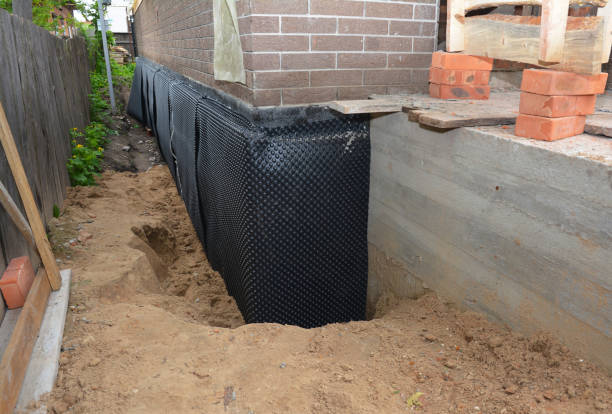 SJ Waterproofing Pros technician performing targeted Waterproofing assessment in Chatham, IL